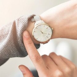 A person checking their wristwatch.