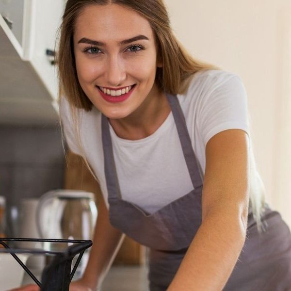 A maid smiling.